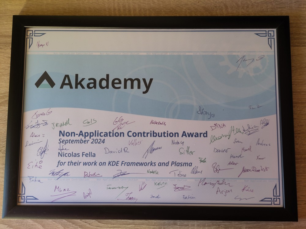 A framed award titling: Non-Application Contribution Award September 2024 Nicolas Fella for their work on KDE Frameworks and Plasma